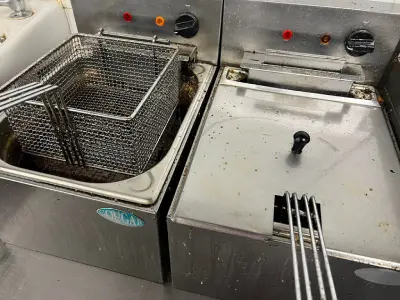 Dirty kitchen fryer before cleaning